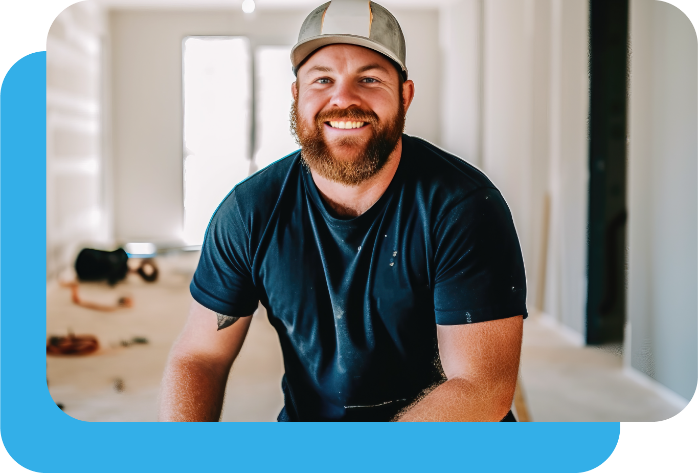 Professional house painter at job site smiling and facing camera